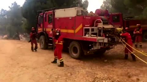 Fires surround Spain military vehicle battling blazes