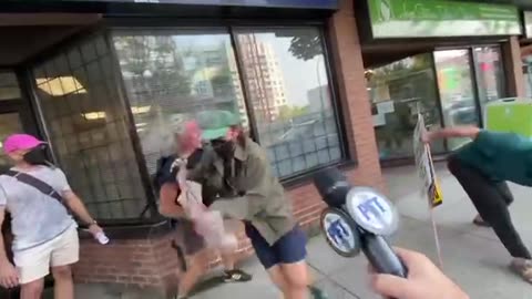 🇨🇦 Unhinged zombies in British Columbia attack a man because of his sign.