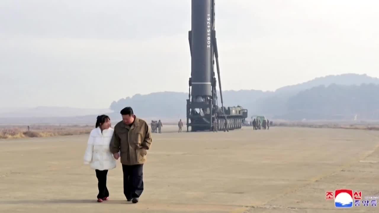 North Korea's Kim reveals daughter at missile test