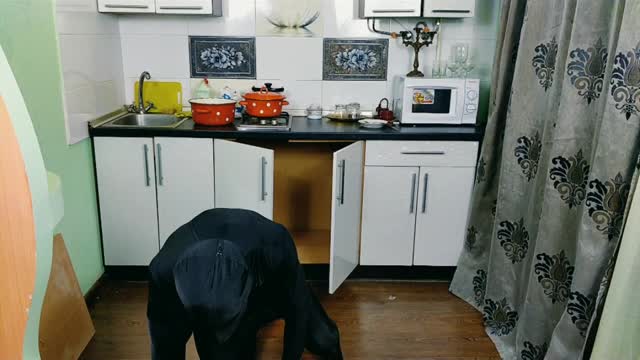 An unknown creature in a tight black suit behaves very strange and unpredictable