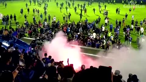 Teargas fired at Indonesian football match, causing crowd crush