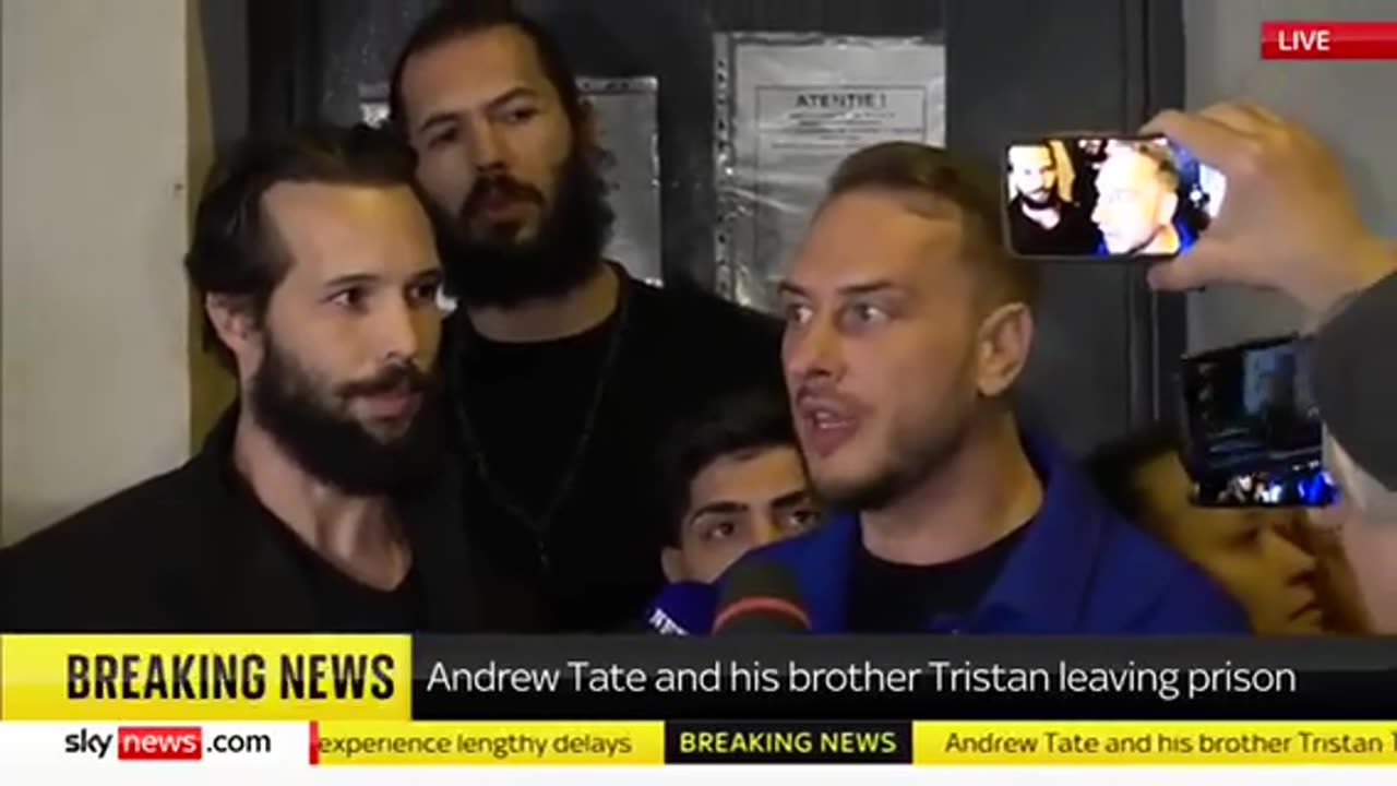 Andrew Tate and his brother Tristan being released from prison