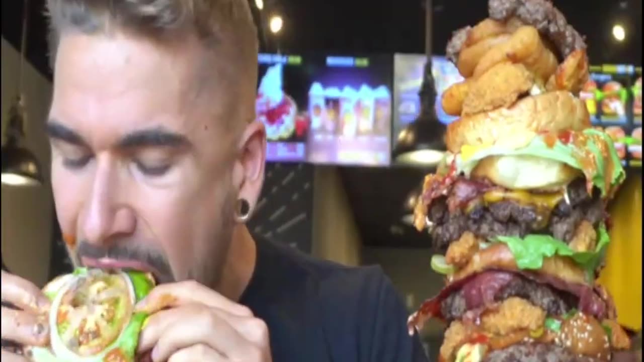 Title: "Epic Burger Challenge: Conquering the Monstrous Mega Burger!"