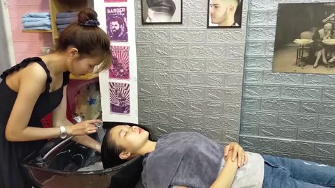 Relaxing shampoo and facial massage at Vietnamese barber shop