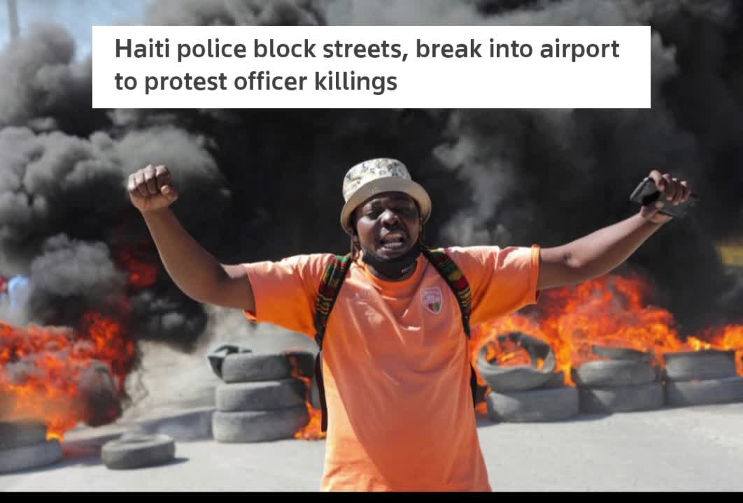 Americas Haiti police block streets, break into airport to protest officer killings