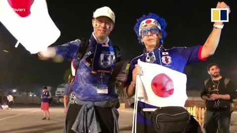Japanese fans celebrate their team’s stunning World Cup upset victory over Germany
