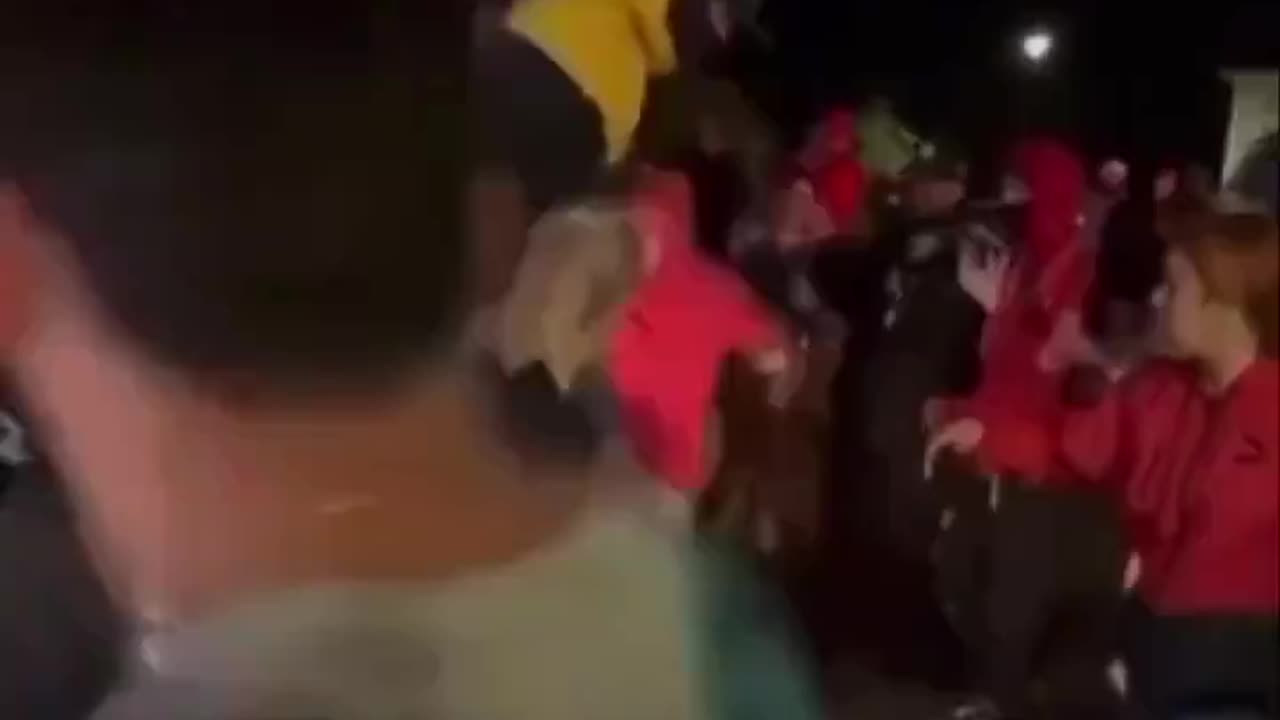 Angry mob damage a woman's car for interfering with their street takeover