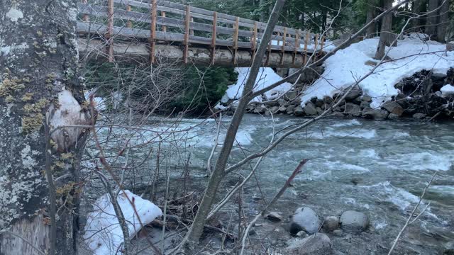 Flowing River Beneath Rustic Single File Log Bridge – Tamanawas Falls – Mount Hood – Oregon – 4K