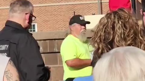 The election official tried to get him to take his Make America Great Again hat off in order to vote