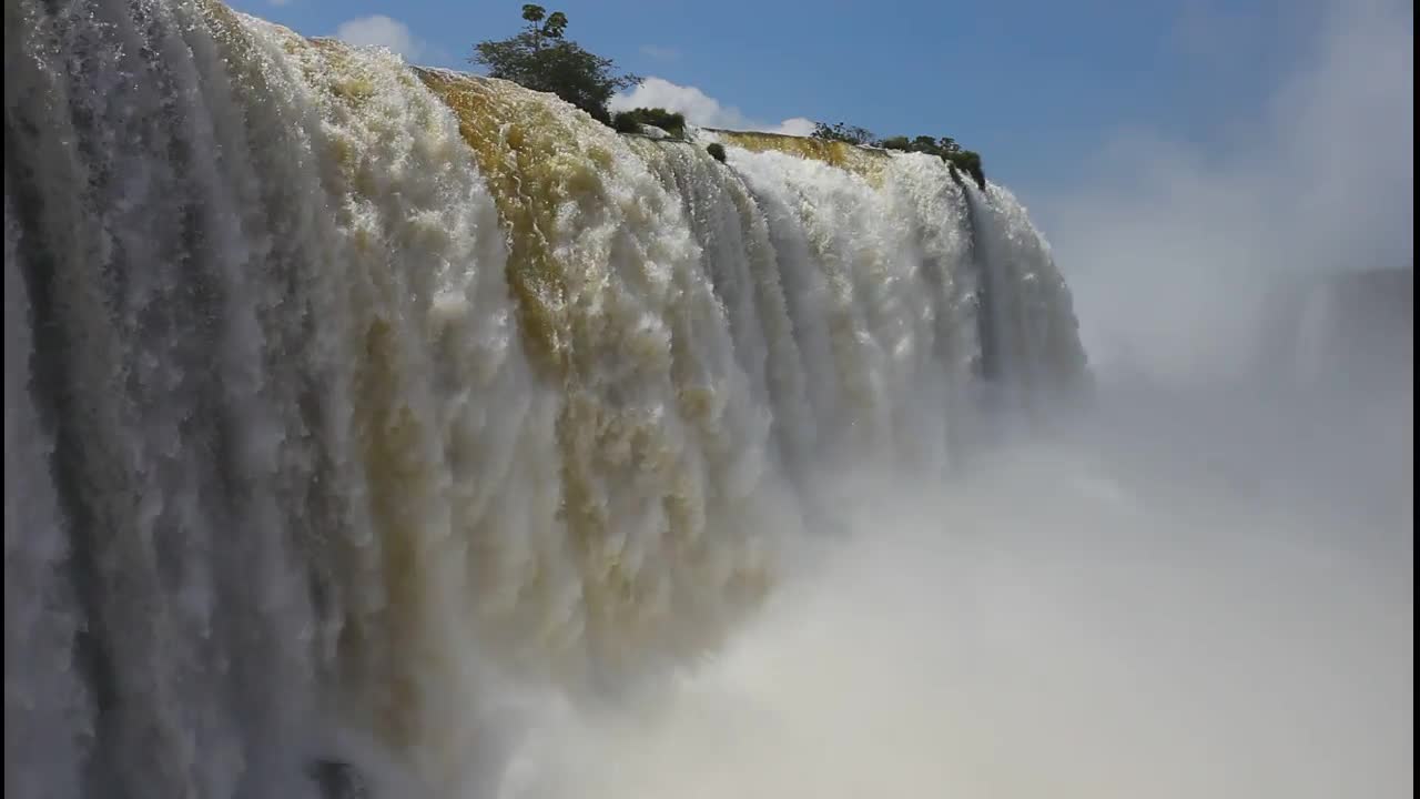 water falls from a mountain or a rock.