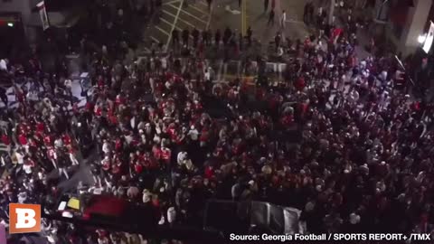 PARTY IN THE STREETS: Georgia Fans Go Wild, Climb Traffic Pole to Celebrate National Championship (