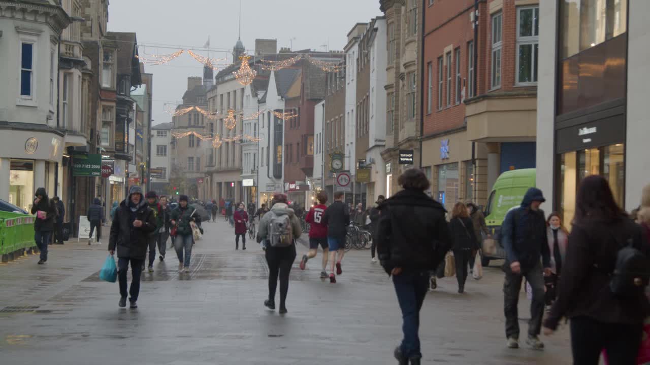 Wide Shot of People Walking Down a Busy Street In Oxford England