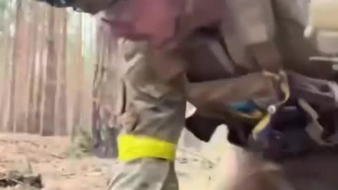 A British man digs a trench in Ukraine to the accompaniment of Russian MLRS.