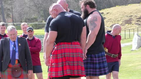 World's Strongest Men in a Tug o' War Challenge at Braemar Gathering Highland Games site in Scotland