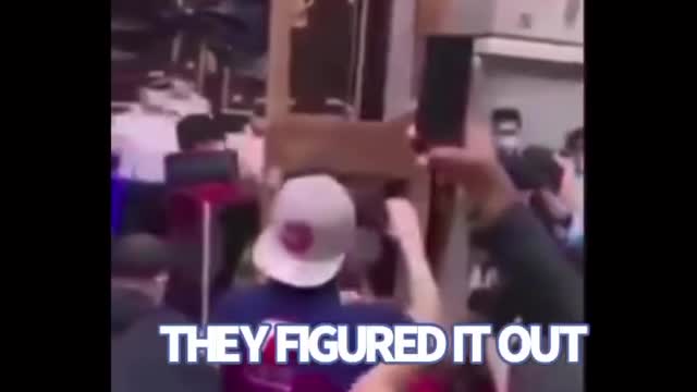 Guatemalans bring a guillotine to parliament