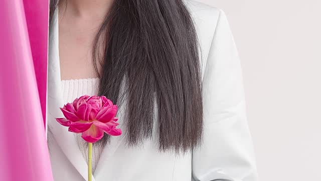 A Young Woman Behind The Pink Curtain