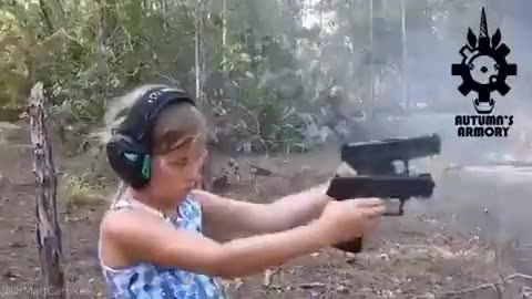 Little girl handles guns well!