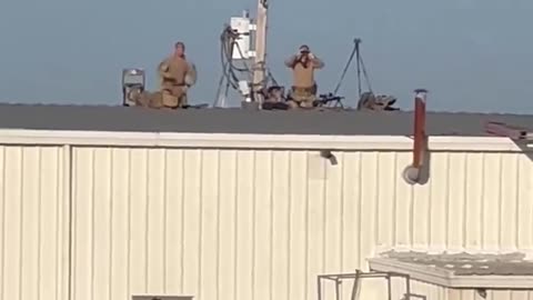 Snipers take position on buildings with sloped roofs for the Trump rally in Butler