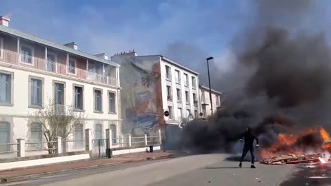 French fishermen throw petrol bombs at the OFB headquarters in the city of Brest...