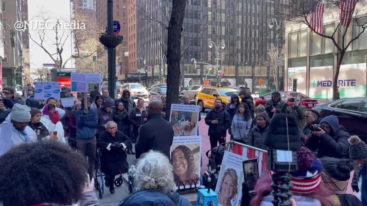 People gather outside Pfizer’s HQ to protest against “medical tyranny.”