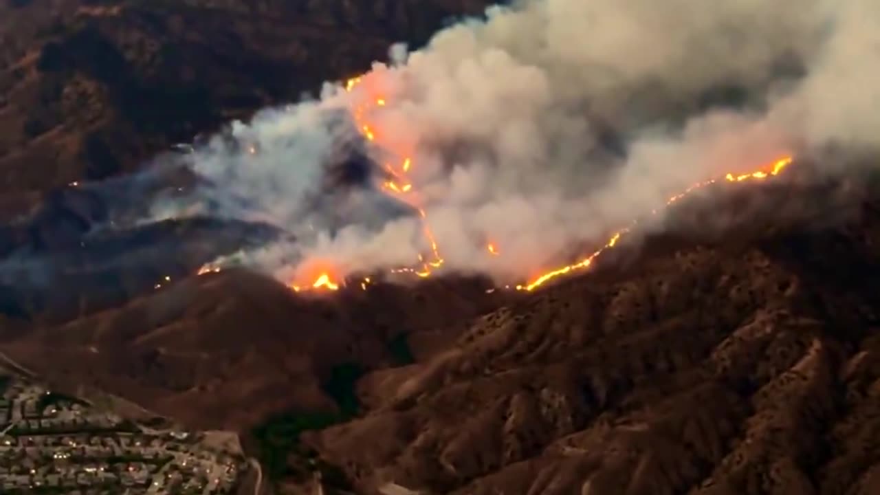 The Line Fire is lighting up the night sky over the city of Highland, CA