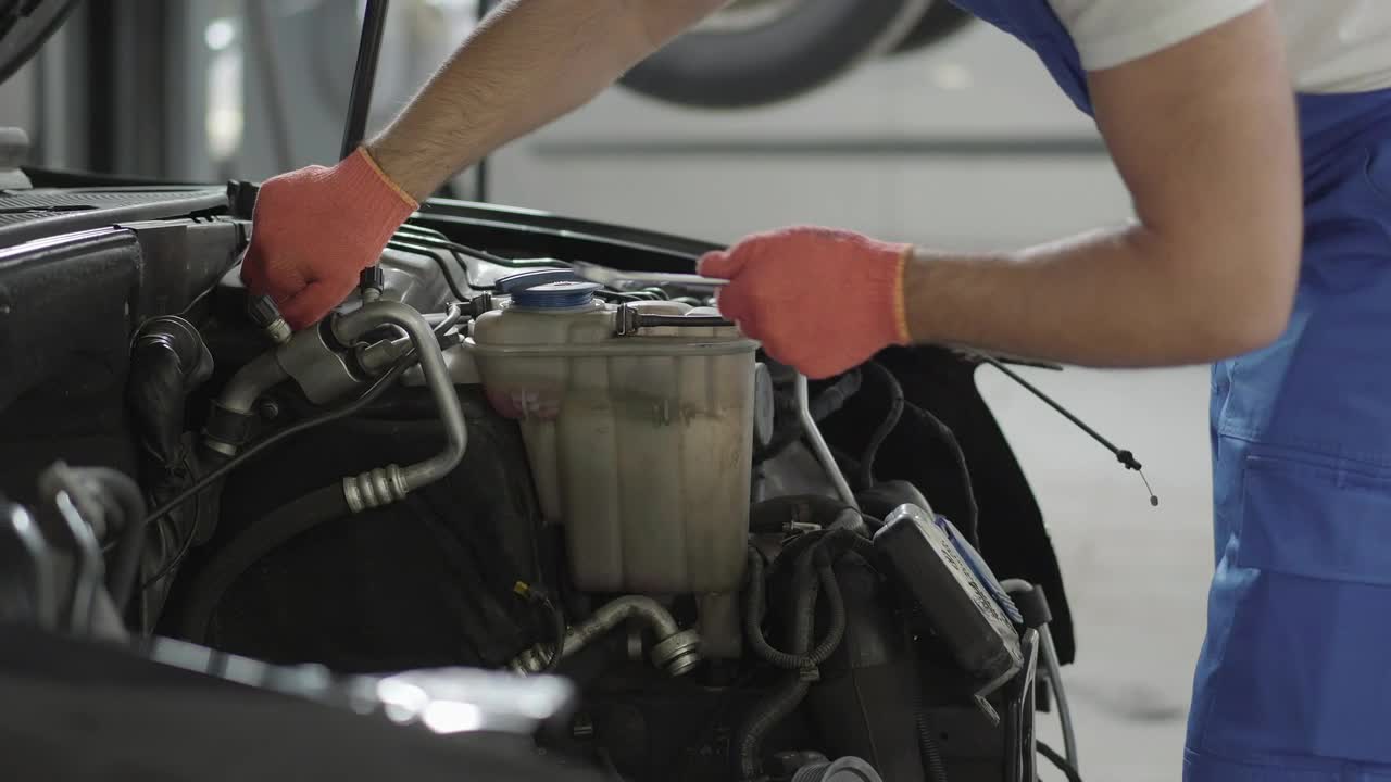 Mechanic repairing a car engine