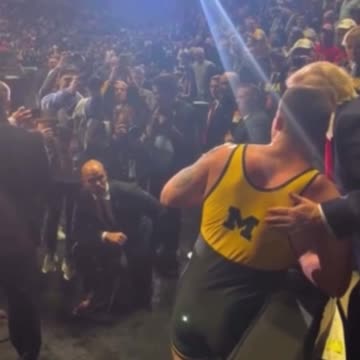 NCAA wrestlers, including champ Patrick Glory, walk over to shake President Trump’s hand