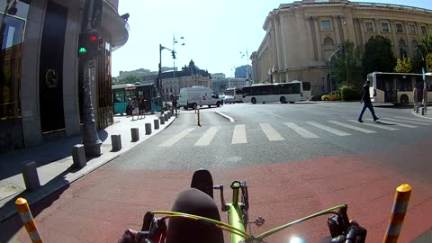 Speedy Bicyclist Can't Stop Hitting the Side of a Bus