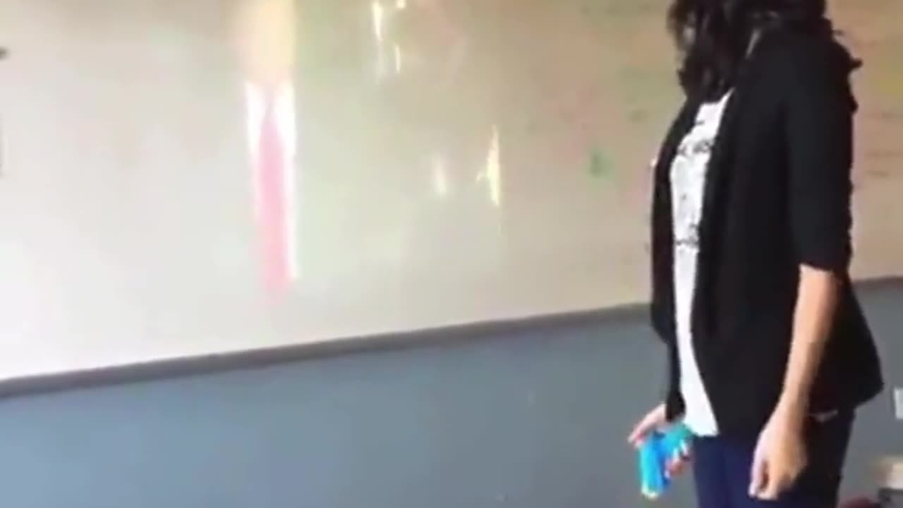 Teacher pretending to assassinate Donald Trump in front of her students