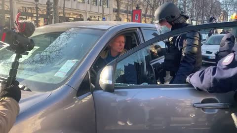 Paris police break window of protester car with battery failure unable to move