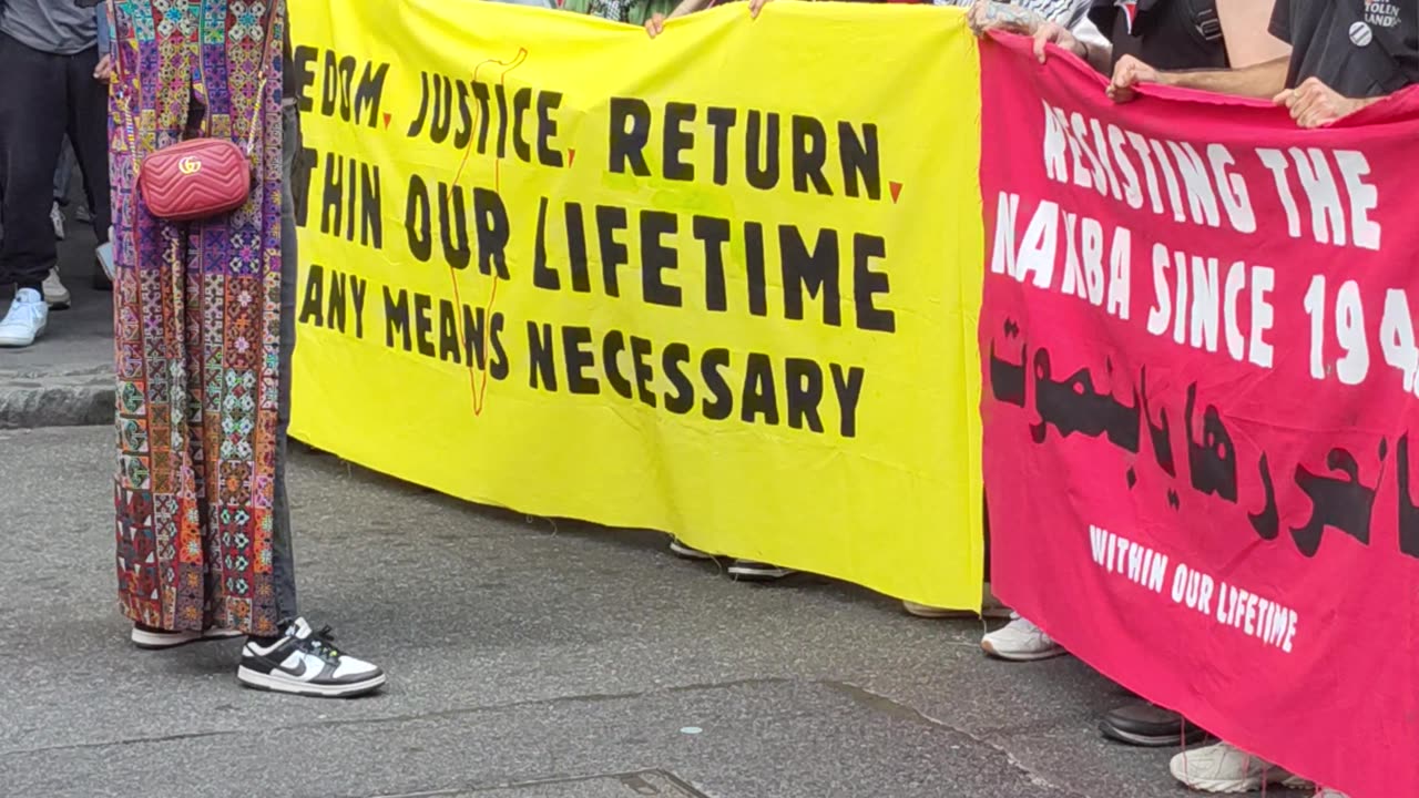 "FLOOD New York City FOR PALESTINE" in front of the NYC City Hall.