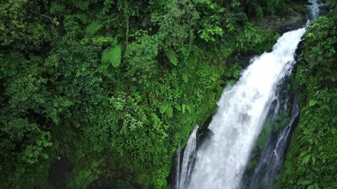 Drone Captures close footage of splashing Waterfall