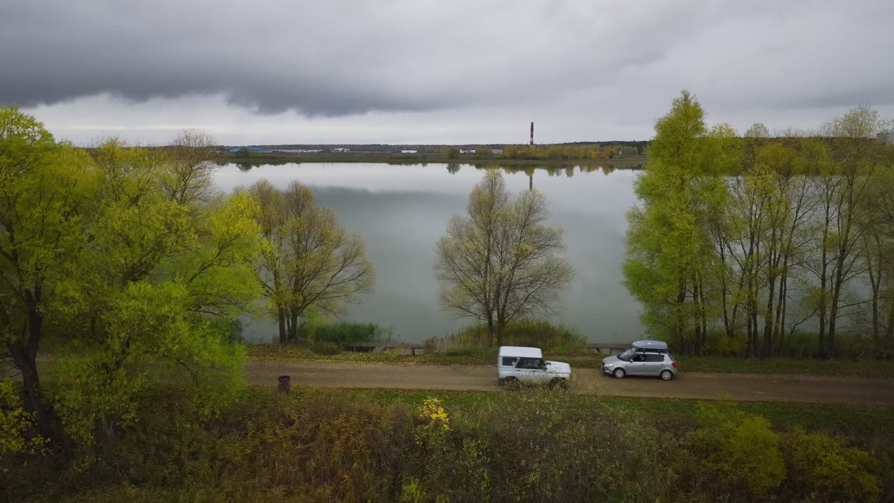 Cars on the Road Beside Green Trees