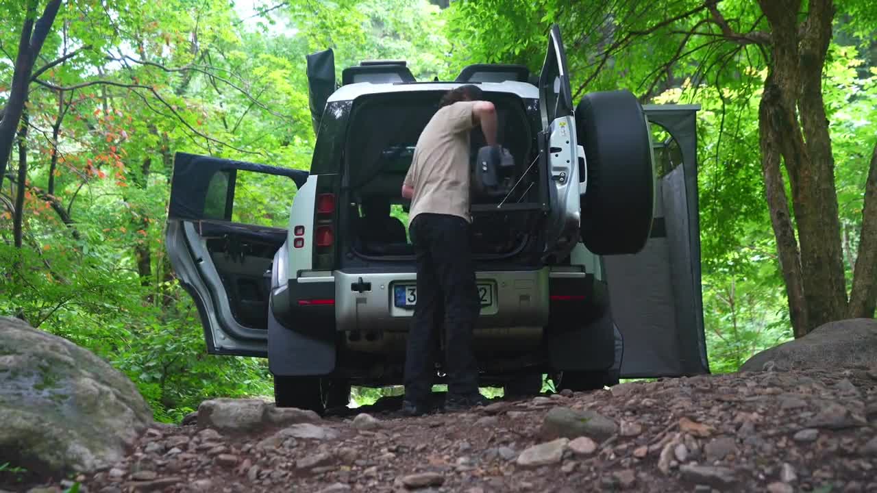 Light self driving camping in summer, listening to the sound of water flow at the river valley, enjo