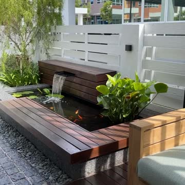 "Shaded Oasis: A Relaxing Patio with a Small Aquarium Touch"