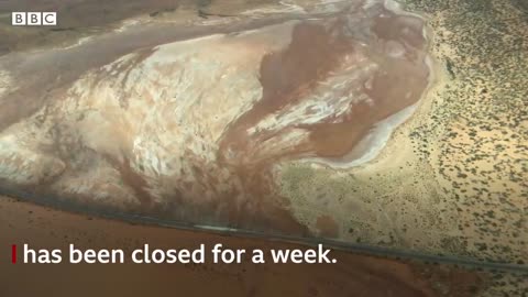 Australian floods cut off outback towns and major supply routes - BBC News