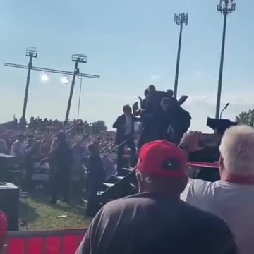 A new angle from the attempt on Trump’s life, seen from behind.