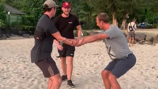 Two Guys Accidentally Bang Their Heads Into Each Other While Attempting to Catch Friend