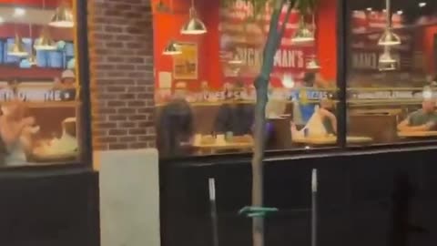 The police officer simply enters the area, utilizes pepper spray on everyone, and departs