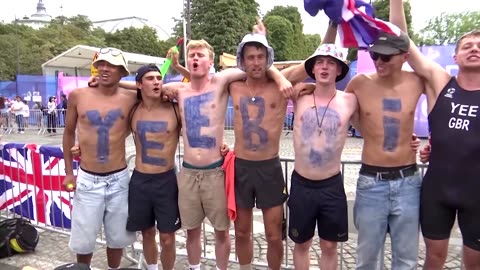 Olympic fans cheer triathletes as the Seine passes water tests