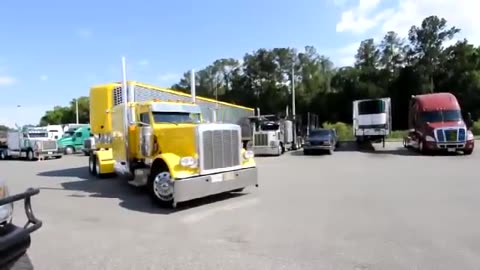 Professional driver jackknifing a 53 foot trailer into a parking space.