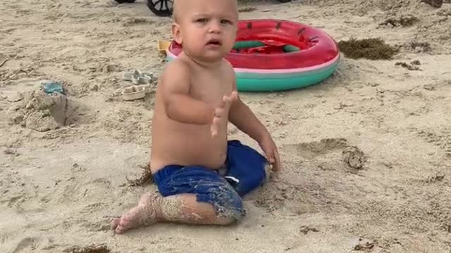 Cute kids are playing on the beach. Funny Baby Game!