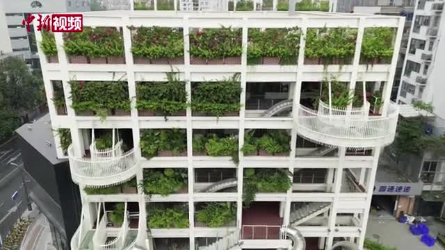 Slides connect the floors of an office building in Chengdu