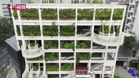 Slides connect the floors of an office building in Chengdu