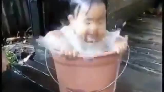 Baby in a bucket