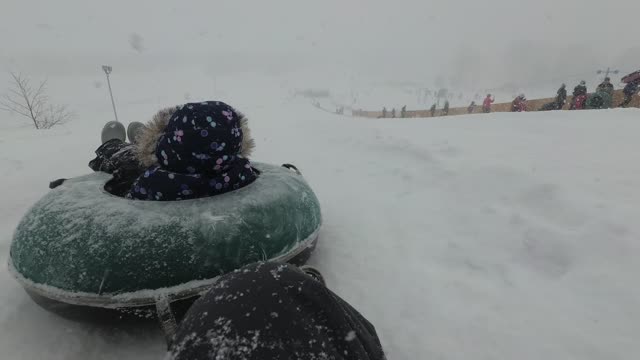 Addison and Me snowtubing 2022