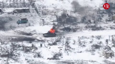 Drone Strikes: Intense Footage of Russian Tank Engulfed in Flames Amid Snowy Battlefield
