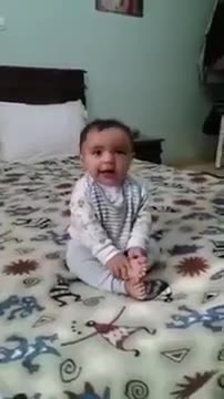 Baby is dancing with music