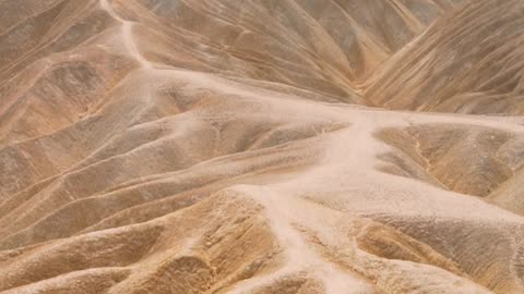 Between Dunes & Skies