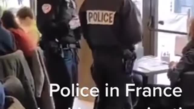 Police in France checking vaccination passport at restaurant